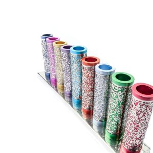 Menorah of colorful metal tubes wrapped with metal pomegranate cutouts