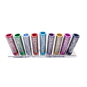 Menorah of colorful metal tubes wrapped with metal pomegranate cutouts