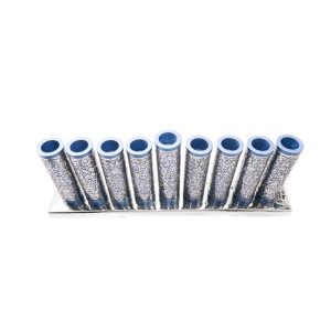 Menorah of blue metal rolls wrapped with metal cutouts of pomegranates