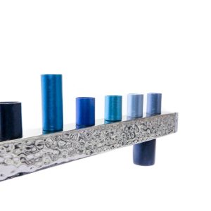 Menorah made of hammered aluminum bar with nickel coating and blue-toned reeds