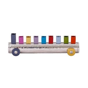 Menorah in the shape of a small train with colorful candles