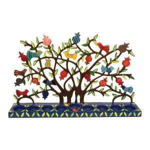 Laser cut menorah with a pattern of pomegranate tree and birds